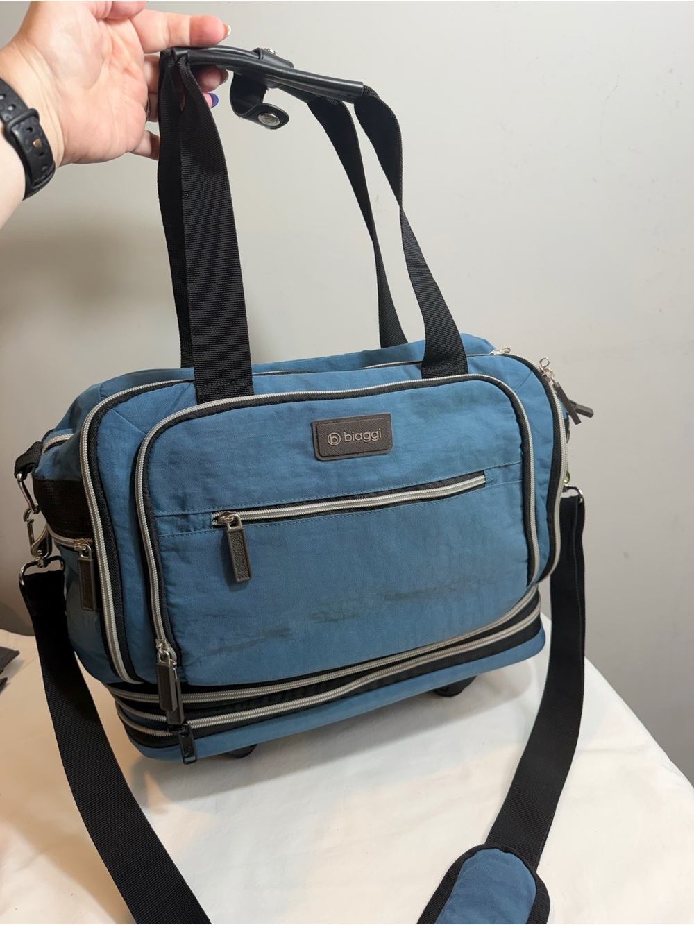 Biaggi Zipsak Boost blue packable expandable travel carryon with wheels